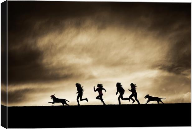  Silhouettes of running Girls and Dogs  Canvas Print by Maggie McCall