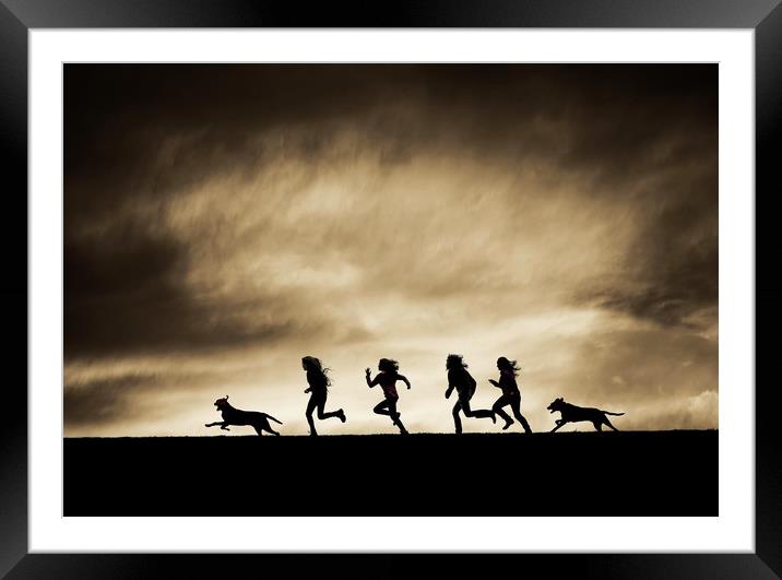  Silhouettes of running Girls and Dogs  Framed Mounted Print by Maggie McCall