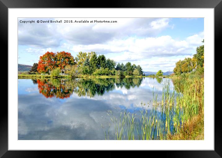 Autumn reflections on a New England lake, America. Framed Mounted Print by David Birchall