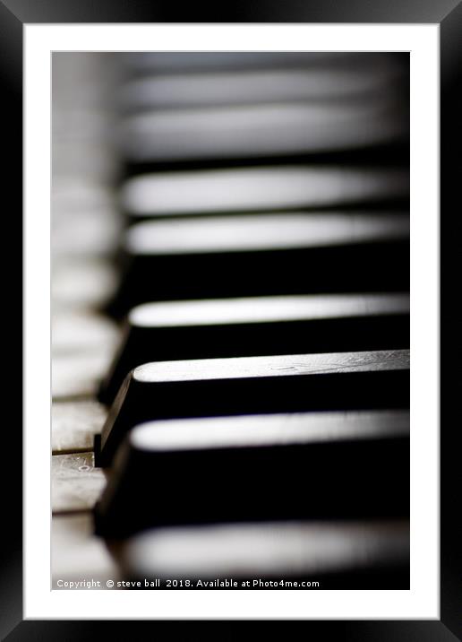 Old piano keys close up Framed Mounted Print by steve ball