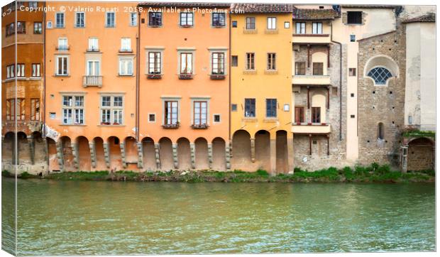 Ancient houses overlooking the Arno river  Canvas Print by Valerio Rosati