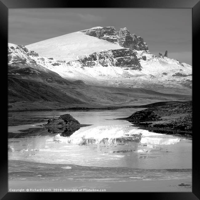 The Storr partially reflected in the Storr Lochs 2 Framed Print by Richard Smith