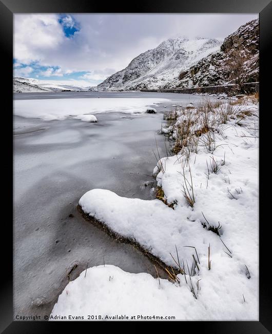 Snowfall at Ogwen Lake Snowdonia Framed Print by Adrian Evans