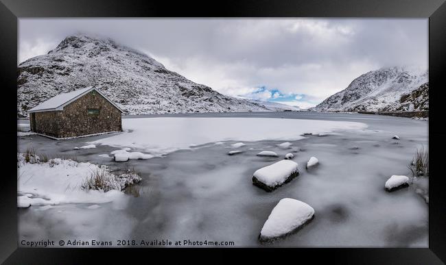 Frozen Ogwen Lake Snowdonia Framed Print by Adrian Evans