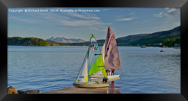 Two sailing dinghies return to the Sailing Club Framed Print by Richard Smith