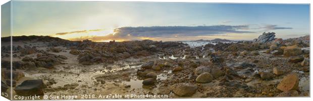 sunrise over rocky shoreline Canvas Print by Sue Hoppe