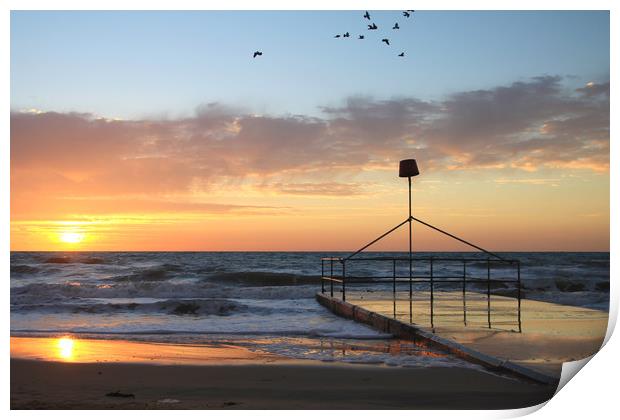 Dawn sunrise over seaside holiday resort Print by Steve Mantell