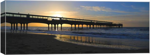 Coastal holiday perfect sunrise over pier with sea Canvas Print by Steve Mantell