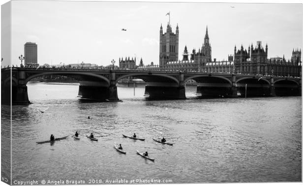 Kayaks by Thames river at Westminster Bridge Canvas Print by Angela Bragato