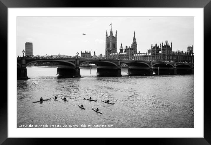 Kayaks by Thames river at Westminster Bridge Framed Mounted Print by Angela Bragato