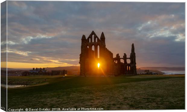 Sun setting at Whitby Abbey Canvas Print by David Oxtaby  ARPS