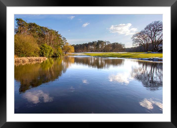 Lake water reflections with vivid sky and clouds Framed Mounted Print by Steve Mantell
