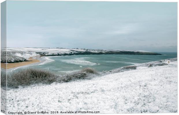 Snow over Pentire and Crantock Beach Canvas Print by Diane Griffiths