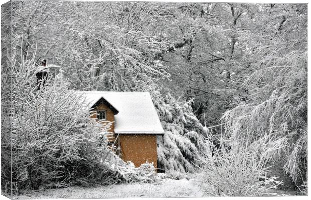 A cottage in the snow Canvas Print by Jeremy Fennell