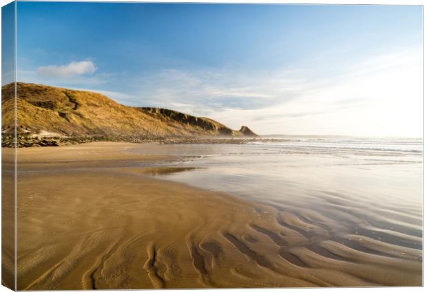 Ripples in the sand at Newgale Beach. Canvas Print by Colin Allen