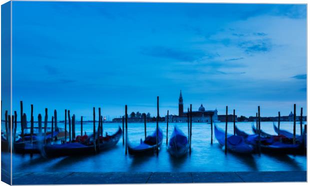 Moving Gondolas  at Twilight, Venice. Canvas Print by Maggie McCall