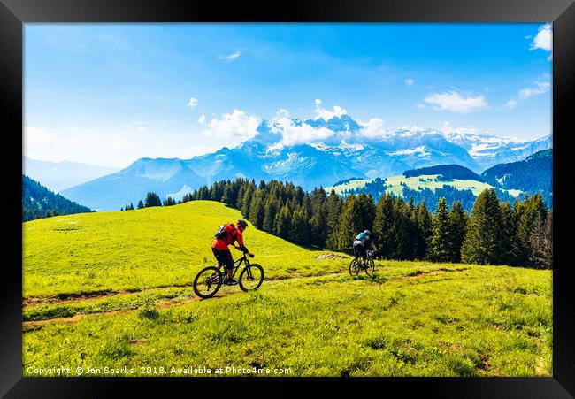 Mountain bikers and Dents du Midi Framed Print by Jon Sparks