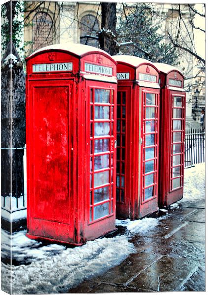 Three Red Telephone Boxes Canvas Print by Karen Martin