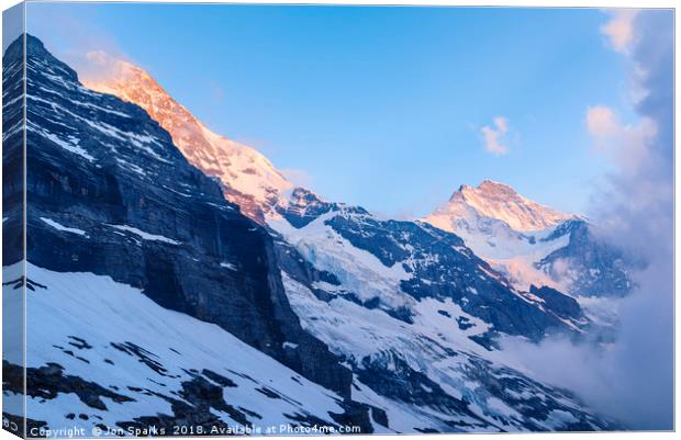Monch and Jungfrau Canvas Print by Jon Sparks