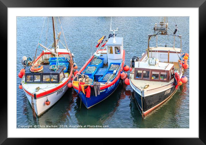 Fishing boats moored in Mevagissey harbour in Corn Framed Mounted Print by Chris Warham