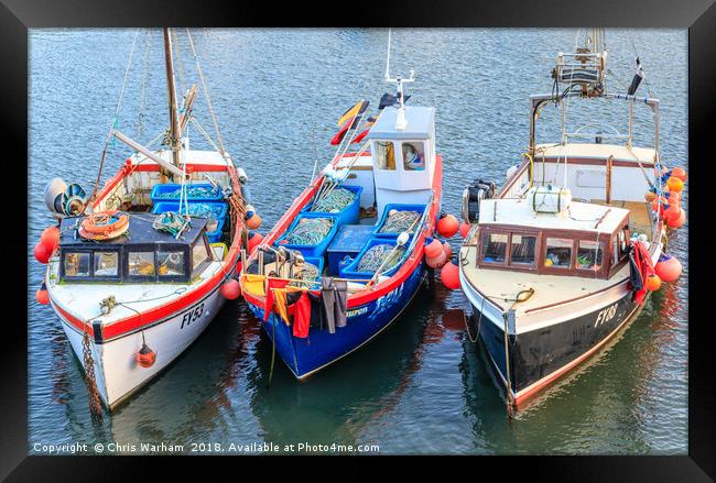 Fishing boats moored in Mevagissey harbour in Corn Framed Print by Chris Warham