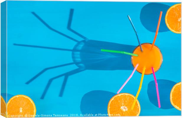 Orange juice and sliced oranges in sunlight Canvas Print by Daniela Simona Temneanu