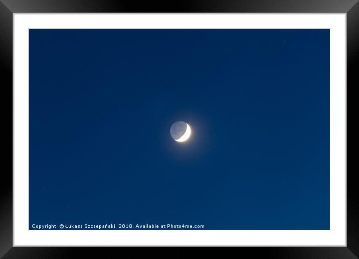 Moon's grey light against blue starry sky backgrou Framed Mounted Print by Łukasz Szczepański