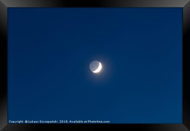 Moon's grey light against blue starry sky backgrou Framed Print by Łukasz Szczepański