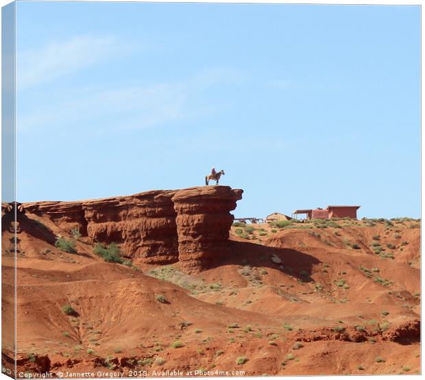 Lone cowboy in Monument Valley Canvas Print by Jannette Gregory