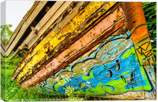Graffiti on old boat Canvas Print by Jon Sparks