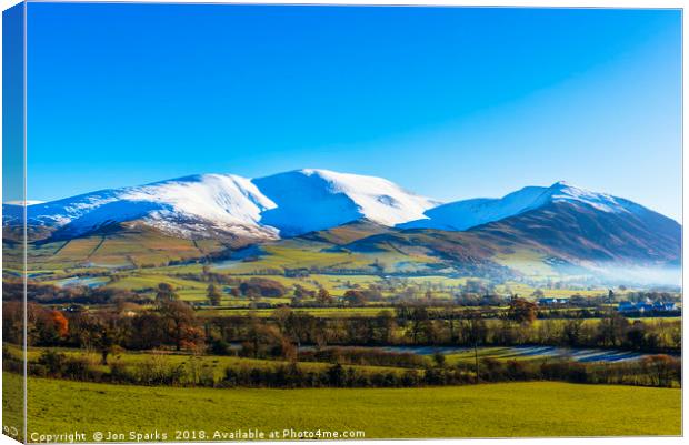 Snow on Skiddaw and Ullock Pike Canvas Print by Jon Sparks