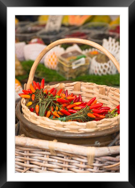 Red hot chillies in a basket Framed Mounted Print by Andrew Michael
