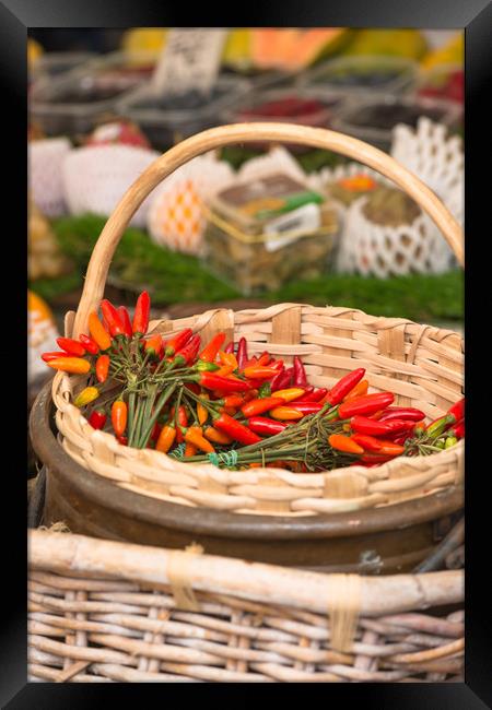 Red hot chillies in a basket Framed Print by Andrew Michael