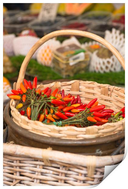 Red hot chillies in a basket Print by Andrew Michael