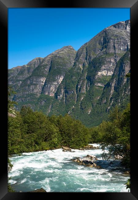 River through the mountains near Briksdals Glacier Framed Print by Andrew Michael