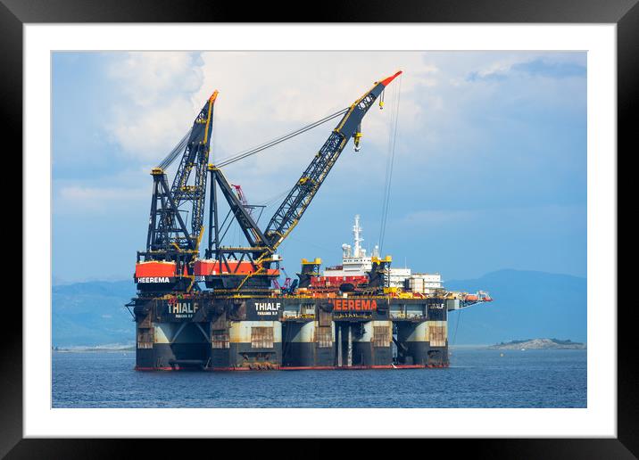 Oil rigs off the coast of Norway Framed Mounted Print by Andrew Michael