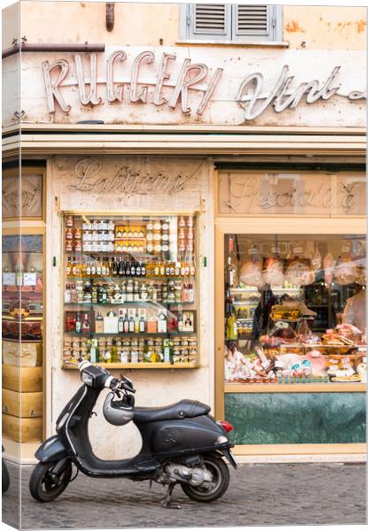 Vespa scooter outside traditional Grocery store Canvas Print by Andrew Michael