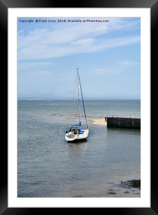 A yacht lies at anchor in Abersoch Harbour Framed Mounted Print by Frank Irwin
