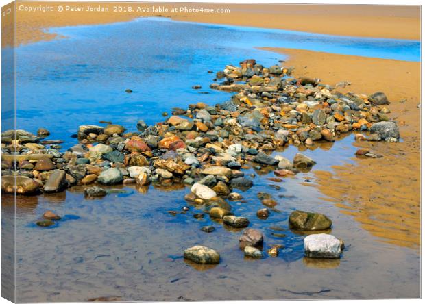 Pool on a sandy beach at low tide with cobbles and Canvas Print by Peter Jordan
