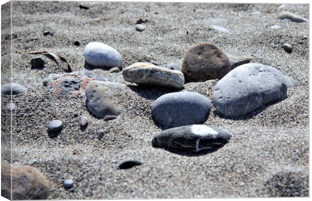 Pebbles on a Cretan Beach Canvas Print by Peter Elliott 