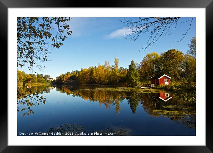Little red hut on a lake Framed Mounted Print by Carmen Goulden