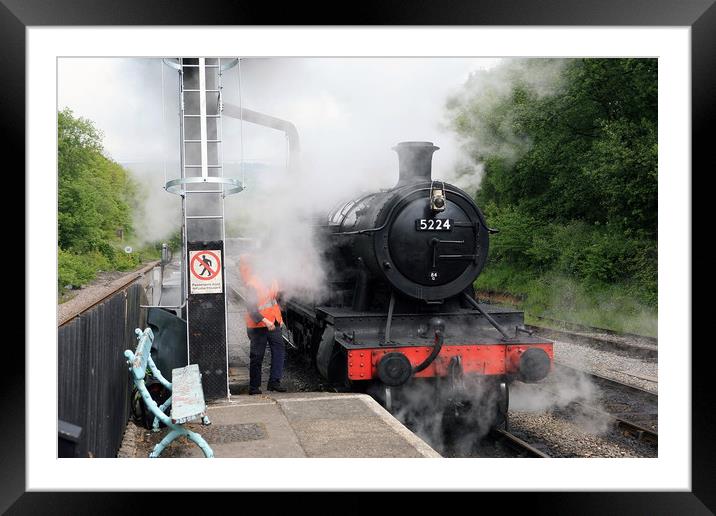 Steam Train taking on water Framed Mounted Print by William A Dobson