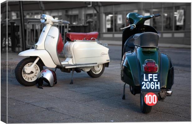 Vespa Sprint and Lambretta Li in town Canvas Print by Donnie Canning