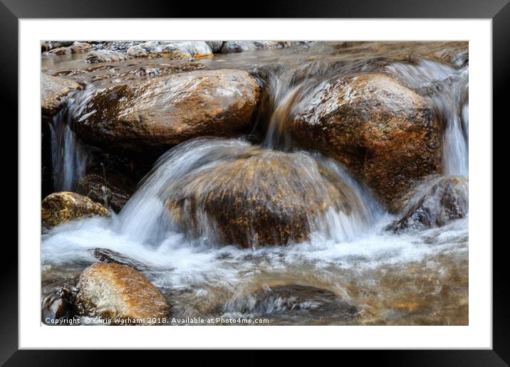 Water splashing over rocks in a mountain stream Framed Mounted Print by Chris Warham