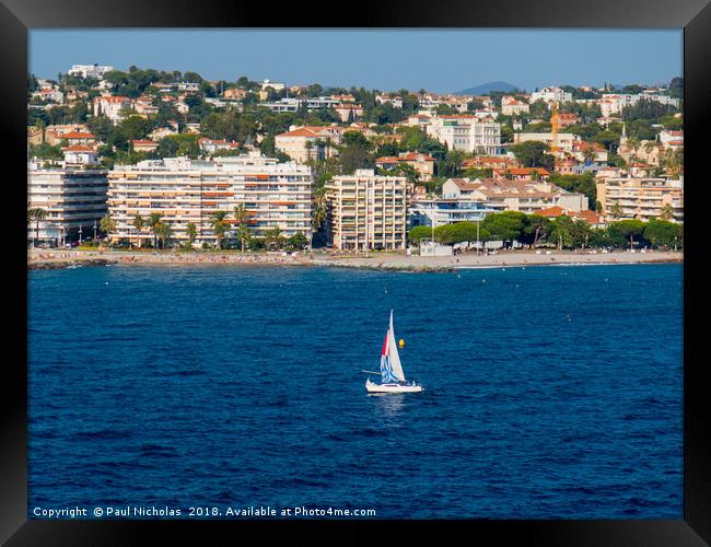 Yacht on the water at St Raphael Framed Print by Paul Nicholas