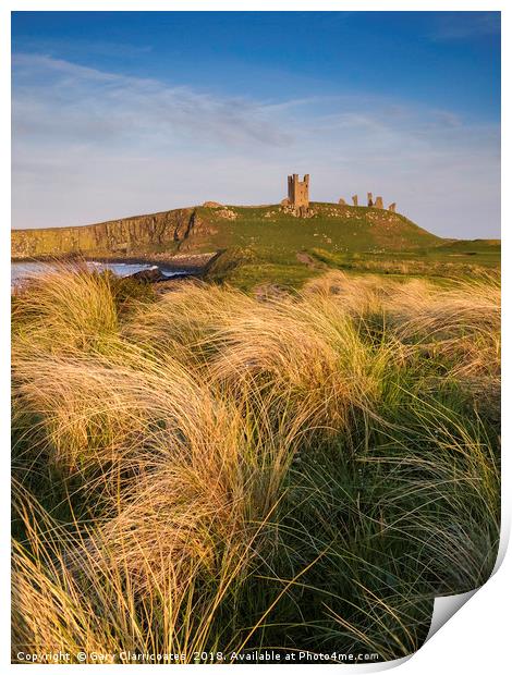 Golden light at Dunstanburgh Castle Print by Gary Clarricoates
