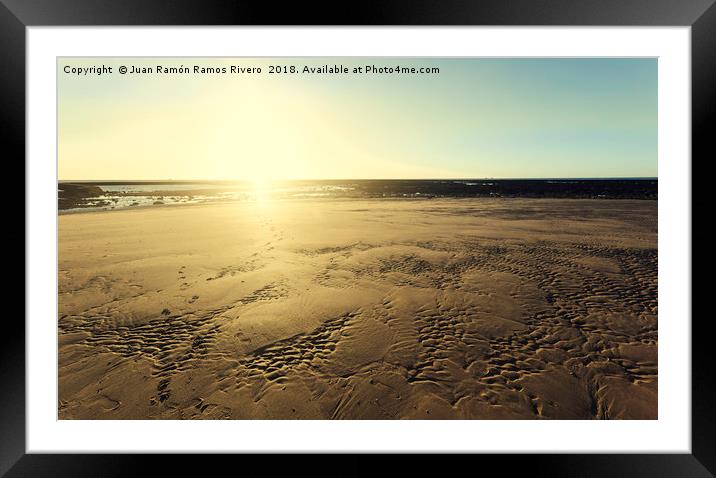 Sunset sun illuminating the sand of the beach Framed Mounted Print by Juan Ramón Ramos Rivero