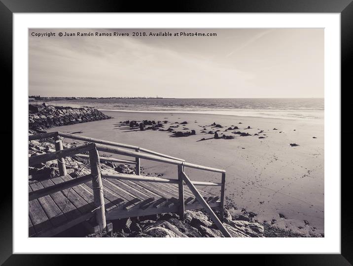 Wooden jetty over the breakwater at low tide Framed Mounted Print by Juan Ramón Ramos Rivero
