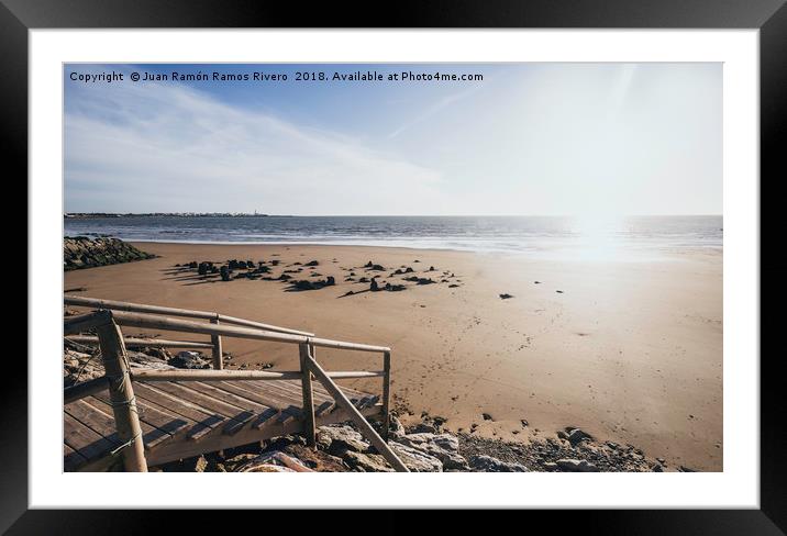 Wooden jetty over the breakwater at low tide Framed Mounted Print by Juan Ramón Ramos Rivero