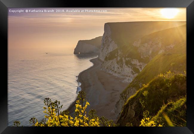 Sunset along the Jurassic coast in Dorset, England Framed Print by KB Photo
